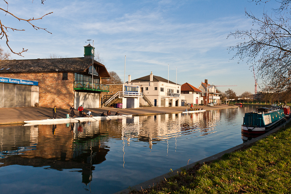 Rowing boats and house boats on the River Cam