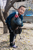 071105-3293 Kyrgyz boy with male turkey (in Barskoon)