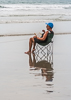 110904-1794 A woman reading on the beach, Cape Canaveral