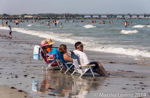 People relaxing on Cape Canaveral beach on Memorial Day weekend