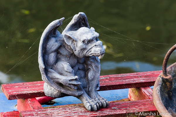 Gargoyle tied to deck of houseboat, Cambridge