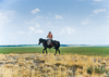 950709-157a-26 Herdsman atop Iron Age burial mound, Sergeevka, Kazakhstan