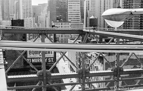 Walking across Brooklyn Bridge towards Manhattan